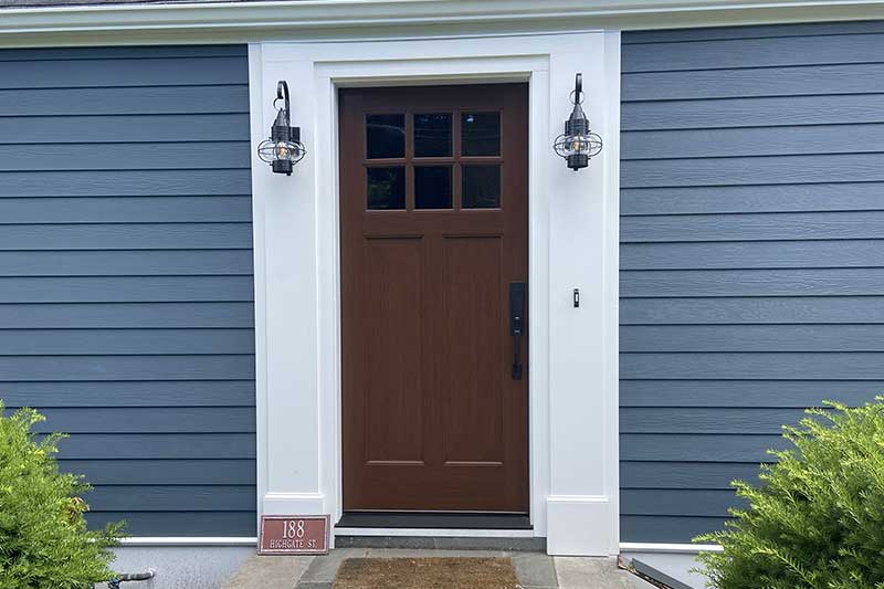 door_installations Closeup of a newly installed door and siding on a home.