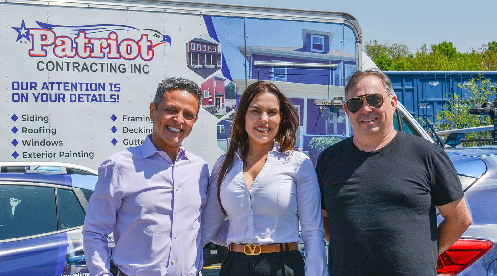 patriot_home_pic Patriot Contracting executive team standing in front of branded vehicles.
